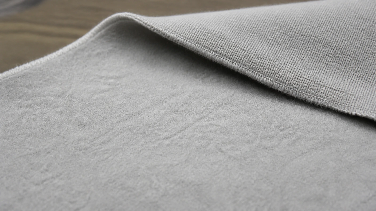 What Is the Difference Between Fleece and French Terry Hoodies? Close-up of the soft napped interior of brushed sweatshirt fleece