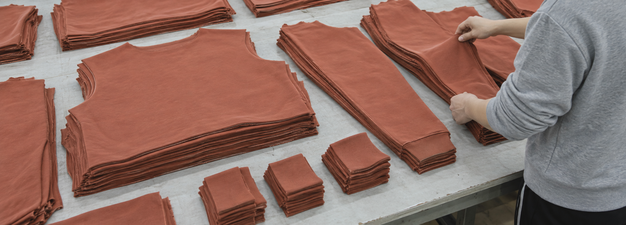 Quality control team conducting final garment inspection