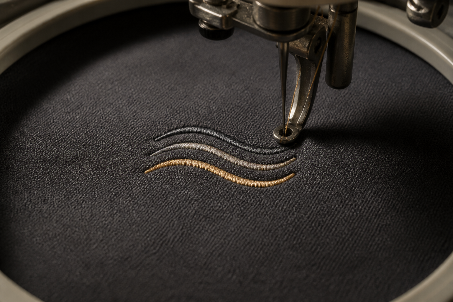 Embroidered logo on hoodie chest -- close-up texture detail