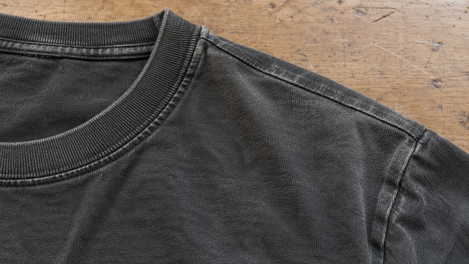 What Makes a T-Shirt Vintage? Age, Tags, Fabric, Print, and Wear Explained Natural fading and wear around an older T-shirt collar and seam